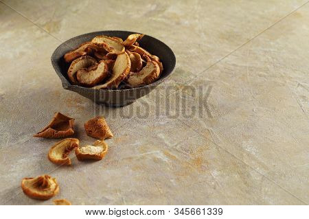 Dried Apple Slices In A Ceramic Cup And On A Textured Yellow Background, Apple Dried Fruits Are Scat