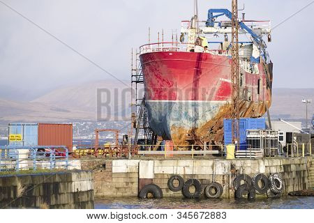 Ship Wreck Vessel And Rescue Lift Crane At Port Dock For Repair Of Capsized Boat