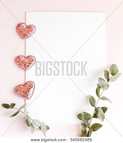 Background With Copy Space Blank On Pink Background With Pink Glittered Hearts, Eucalyptus Branch. W
