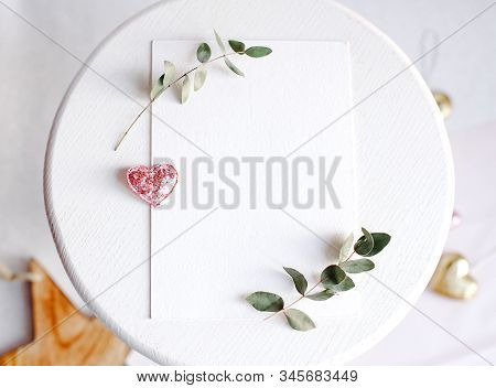 Background With Copy Space Blank On White Table With Glitter Heart, Eucalyptus Branch, Flowers And L
