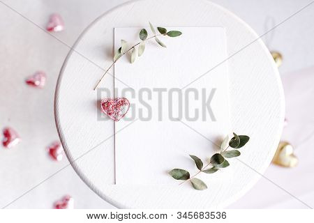 Background With Copy Space Blank On White Table With Glitter Heart, Eucalyptus Branch, Flowers And L