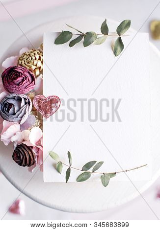 Background With Copy Space Blank On White Table With Glitter Heart, Eucalyptus Branch, Flowers And L