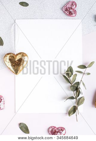 Background With Copy Space Blank On White Table With Glitter Heart, Eucalyptus Branch, Flowers And L