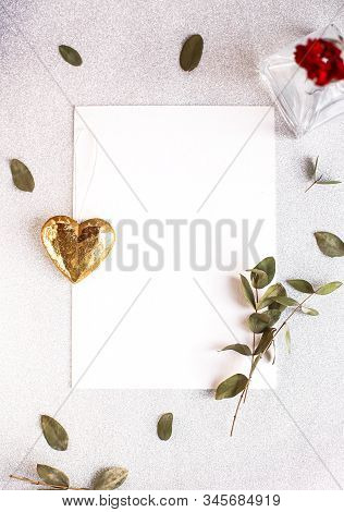 Background With Copy Space Blank On White Table With Glitter Heart, Eucalyptus Branch, Flowers And L