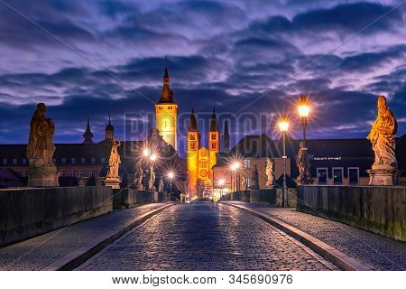 Old Main Bridge, Alte Mainbrucke With Statues Of Saints, Cathedral And City Hall In Old Town Of Wurz
