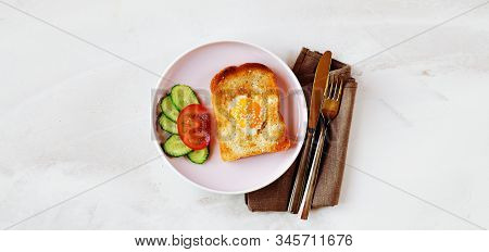 Brunch - An Egg With Sesame Seeds On Toast, Fresh Cucumber And Tomato. Cutlery Lie On A Textile Napk