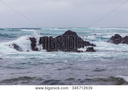 Beautiful Nature Sea Landscape Scene With Black Stone Of Jeju Island, South Korea