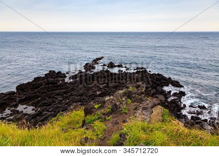 Beautiful Nature Sea Landscape Scene With Black Stone Of Jeju Island, South Korea