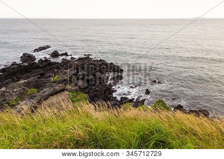 Beautiful Nature Sea Landscape Scene With Black Stone Of Jeju Island, South Korea