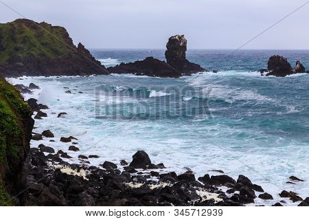 Beautiful Nature Sea Landscape Scene With Black Stone Of Jeju Island, South Korea