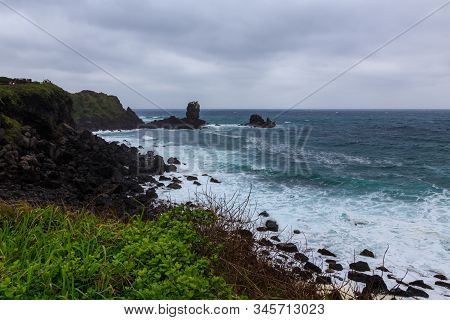 Beautiful Nature Sea Landscape Scene With Black Stone Of Jeju Island, South Korea