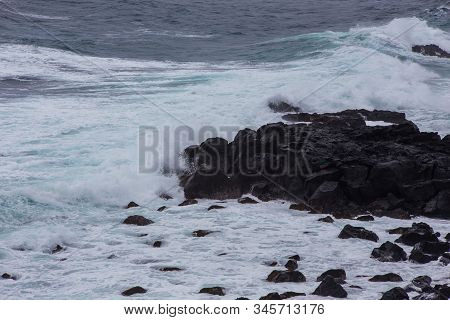 Beautiful Nature Scene Of Sea Wave Hitting On The Black Stone Shoreline At Jeju Island, South Korea.