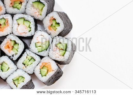 Japanese Set Sushi Rolls, Close Up On White Background. Sopy Space