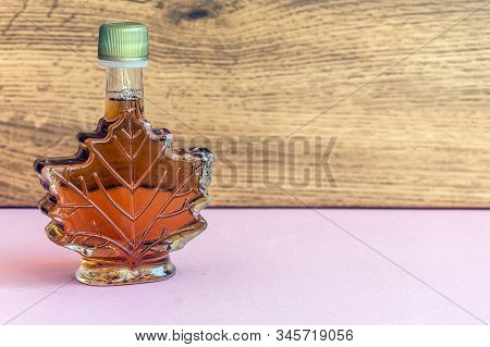Maple Syrup In A Bottle Maple Leaf Shape. Suovenir From Canada.