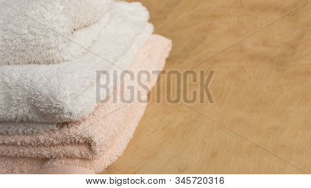 Soft Bath Towel On Wooden Background. Copy Space. Mockup For Design.