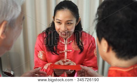 Daugther Give Red Envelop To Father Mother In Chiense New Year