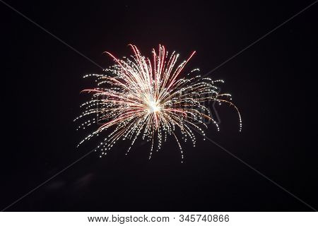 Beautiful Colorful Holiday Fireworks In The Night Sky. Long Exposure. Holiday Concept