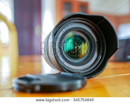Miercurea Ciuc, Romania- 19 January 2020: Panasonic Lumix G Vario 12-60 Lens On Wooden Table , Shall