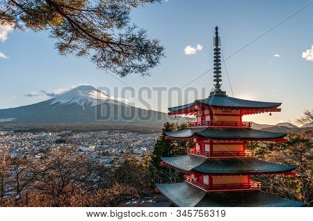 The Last Rays Of The Setting Sun Illuminating Mount Fuji And The Churito Pagode On A December Winter