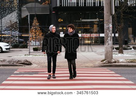 Full Body Of Two Adorable Teenagers Boys Crosswalk Pedestrian Crossing The Street In Winter Cold Wea