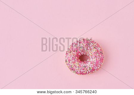 Donats Decorated Sprinkles And Icing On A Pink Background. Creative And Minimalis Food Concept, Top 