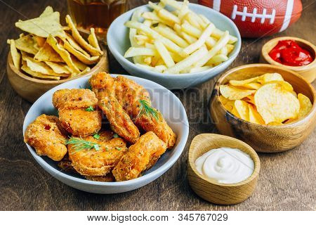Table Fof Tasty Snacks And Beer Prepared For Watching Sports On Tv. Selective Focus