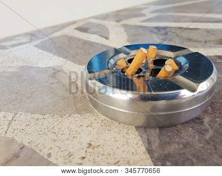 Cigarette Stub Butt Disposal At The Garbage Bin. People Are Addicted, Try To Quit Smoking And It Can