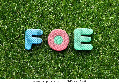 Toy Foam Letter In Word Foe On Green Grass Background