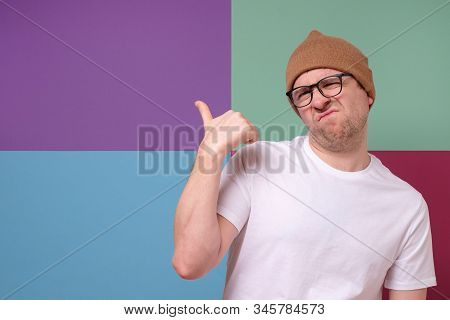 Man Wearing Glasses Points Finger Aside At Questionable Distrustful Announcement