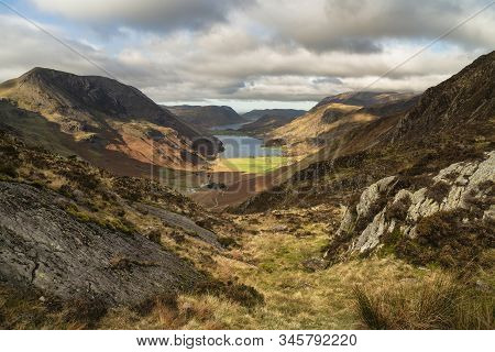 Epic Autumn Fall Landscape Of Buttermere And Crummock Water Surrounded By Mountain Peaks In Lake Dis