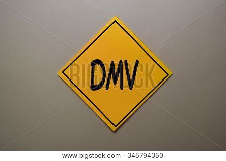 Dmv Write On A Sticky Note Isolated On Office Desk.