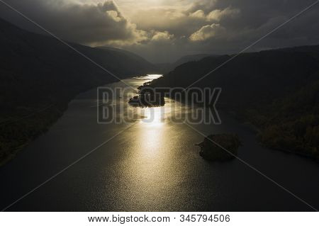 Beautiful aerial drone landscape image of glorious Autumn Fall sun over Thirlmere in Lake District