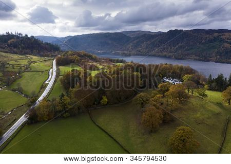 Beautiful aerial drone landscape image of glorious Autumn Fall sun over Thirlmere in Lake District
