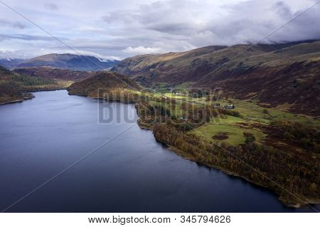 Beautiful aerial drone landscape image of glorious Autumn Fall sun over Thirlmere in Lake District