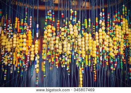 Large Number Of Bright Colored Baubles And Occult Charms Made Of Wood For The Body, Charms For The H