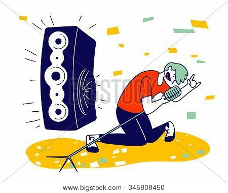 Man Cheering, Dancing And Jumping On Stage Performing Rock Composition In Karaoke Bar. Artist Singin
