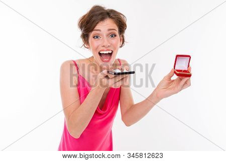 Lovely Caucasian Girl With A Box With A Ring In Her Hands Calls On A Telon And Reports Joy On A Whit