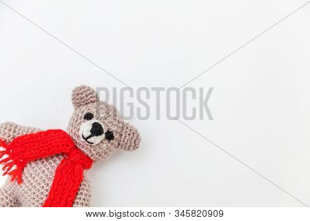 Simply Minimal Design With Toy Bear In Red Scarf Isolated On White Background. Children Care Materin