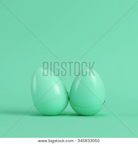 Two Green Eggs With Bottom Part Of Sheel On Bright Green Background In Pastel Colors. Minimalism Con