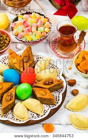 Novruz Ramadan In Azerbaijan. Colored Eggs, Wheat Springs For Easter And Traditional Sweets. Selecti