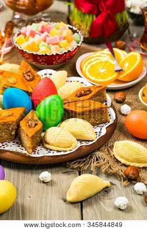 Novruz Ramadan In Azerbaijan. Colored Eggs, Wheat Springs For Easter And Traditional Sweets. Selecti