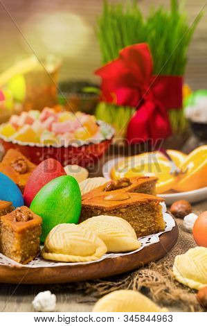 Novruz Ramadan In Azerbaijan. Colored Eggs, Wheat Springs For Easter And Traditional Sweets. Selecti