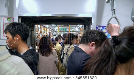 Tokyo, Japan - April, 18, 2018: Interior Shot Of A Crowded Commuter Train In Tokyo