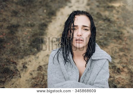 Beautiful Girl Got Wet In The Rain And Froze. Upset Sensual Girl With Wet Hair Looking At Camera. Ad