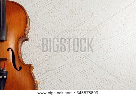 Wooden String Instrument Violin On White Wooden Background With Copy Space
