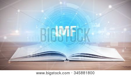 Open book with IMF abbreviation, modern technology concept