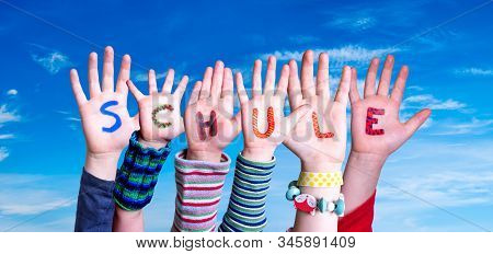 Children Hands Building Word Schule Means School, Blue Sky