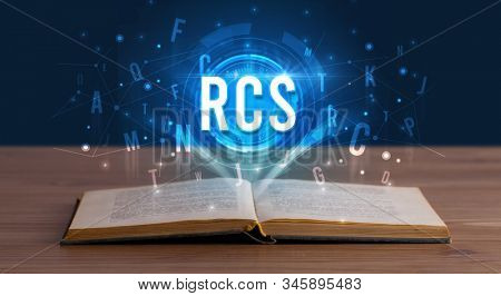 RCS inscription coming out from an open book, digital technology concept