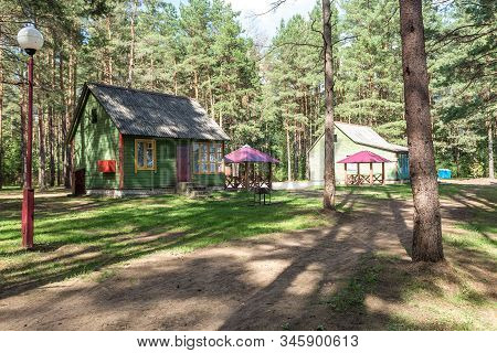 Wooden Camping Arbors  With All Conviniences In A Pine Forest
