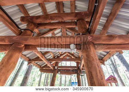 Wooden Camping Arbors  With All Conviniences In A Pine Forest